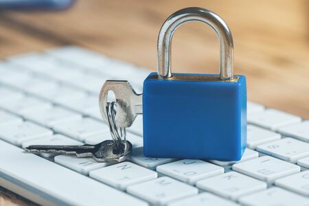 lock and key on keyboard on desk