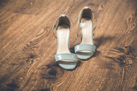 woman fashion shoes on the wooden backgroundの写真素材