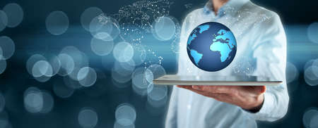 man hand tablet with globe in  screenの写真素材