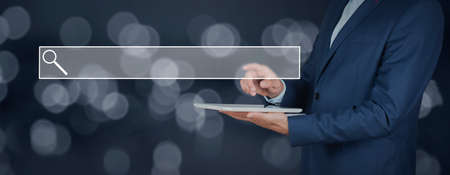 young business man hand tablet on bokeh background