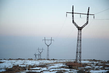 High voltage tower on a background of the winter sky.
