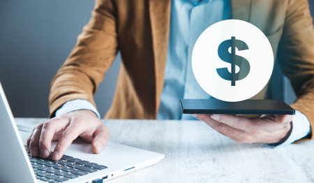 man hand phone and dollar sign in screenの写真素材