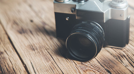 vintage camera on the wooden tableの写真素材