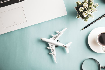 airplane with keyboard and coffee on the deskの写真素材