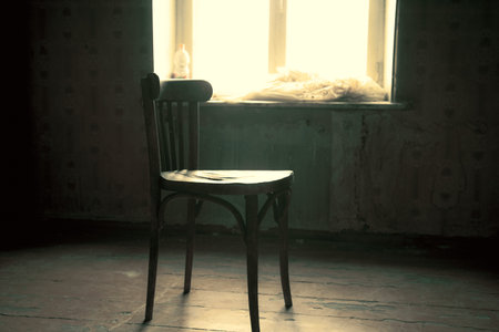 old chair on old and dark roomの写真素材