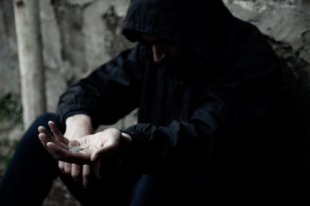 sad man empty hand on dark backgroundの写真素材