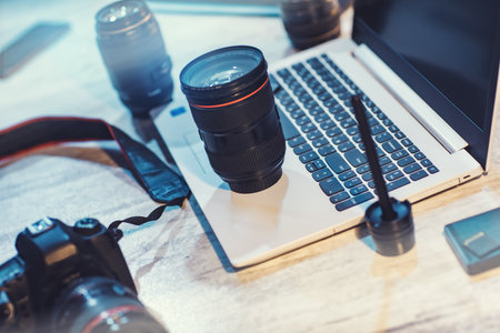 camera lens on the keyboard on deskの写真素材