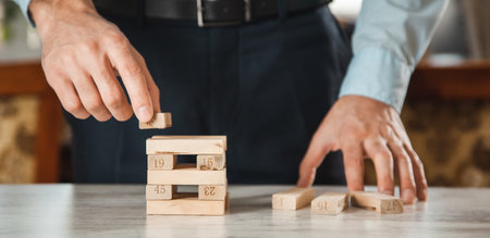business man hand cubes on the desk