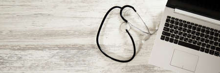 stethoscope with computer on the desk background