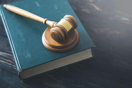 wooden judge on book on the vintage desk background