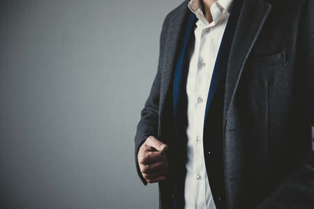 man hand suit button on dark backgroundの写真素材