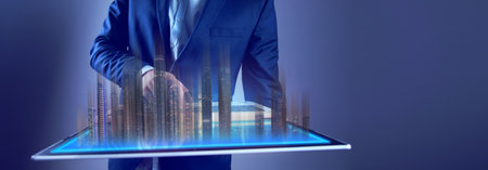 man hand computer with buildings in screen