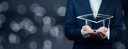 Man holding graduation cap. Education conceptの写真素材