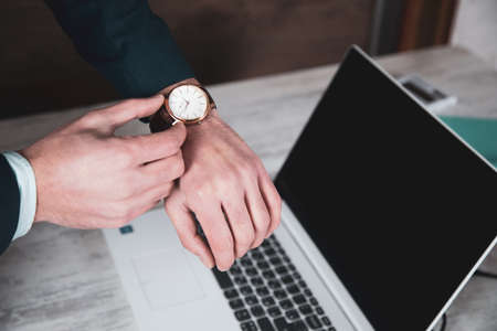 man hand clock on computer keyboard background