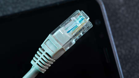 white cabel on the black backgroundの写真素材