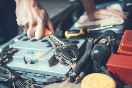 young worker man to repair car backgroundの写真素材
