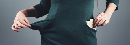 woman hand money on pocket on gray background
