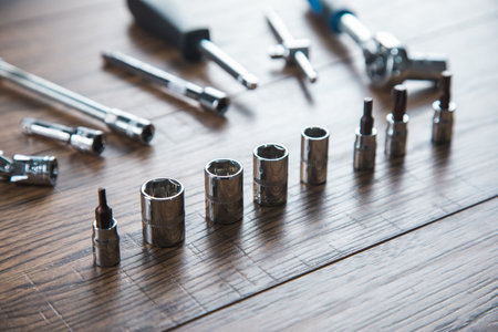 different tools on the wooden table backgroundの写真素材