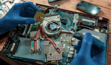 worker man hand holding motherboard on the tableの写真素材