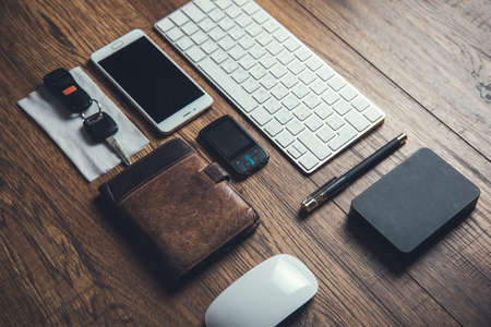 key and wallet on the wooden working desk