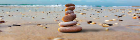 stones stacked on the beach background