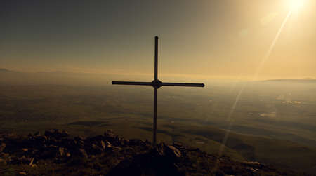 the cross in the mountain under sky backgroundの写真素材