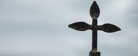 the stone cross under the sky backgroundの写真素材
