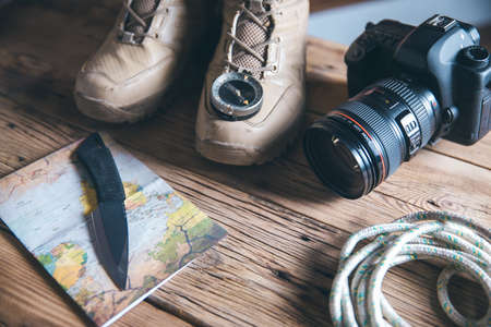 traveling shoe and compass with camera on the tableの写真素材
