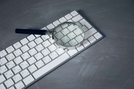 magnifier on the computer keyboard on the table