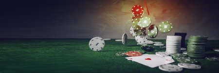 Poker playing chips on a green table