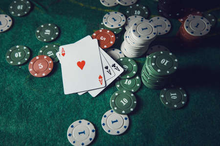 Poker playing chips on a green table
