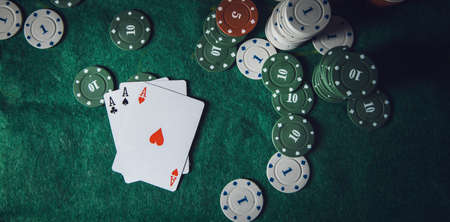 Poker playing chips on a green table