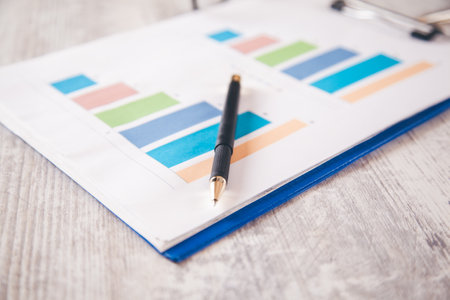 pen on graph in office desk backgroundの写真素材