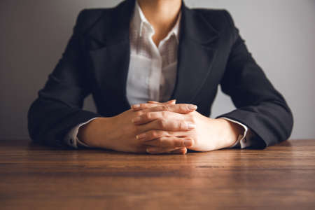 business woman hand cross on the tableの写真素材