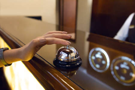 young woman at the hotel reception backgroundの写真素材