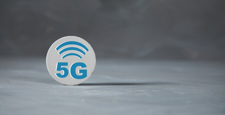 5G wifi sign on the table on gray backgroundの写真素材