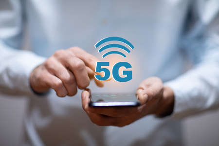 man hand phone and 5G wifi in screenの写真素材