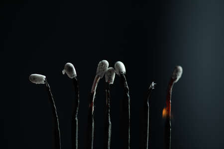 the burning matches on black backgroundの写真素材