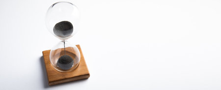 hourglass on the white table backgroundの写真素材