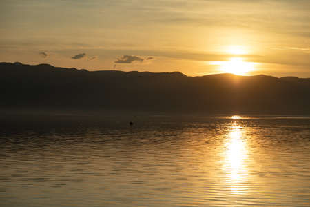 the lake and mountain at the sunsetの写真素材
