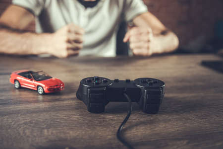 angry man hand controller playing gameの写真素材