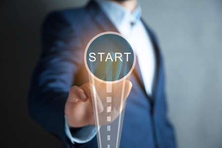 man touching start in the screenの写真素材