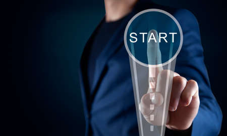 man touching start in the screenの写真素材