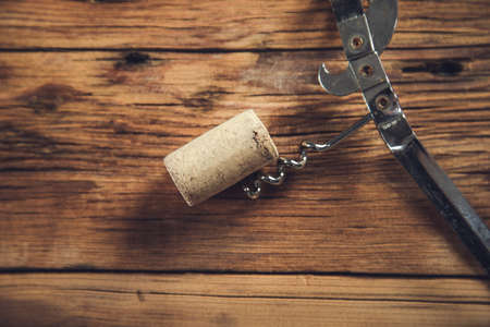 wine cork and corkscrew on the wooden tableの写真素材