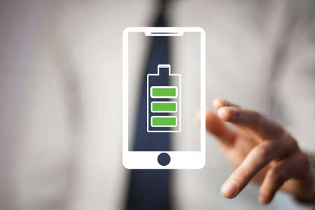 man touching battery with full of energyの写真素材