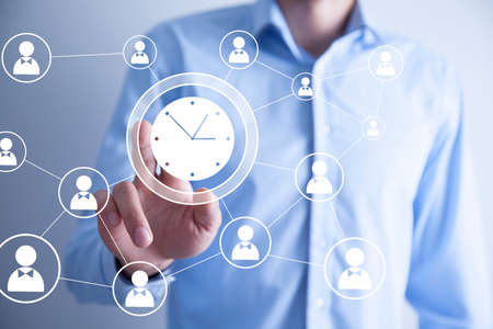 Man touching a time management concept on a touch screenの写真素材