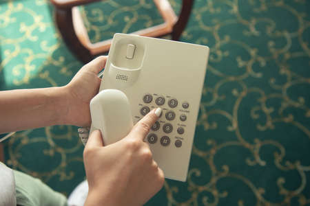 woman hand call phone in the hotel roomの写真素材