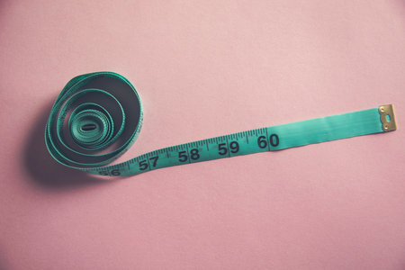 green meter on the pink table backgroundの写真素材