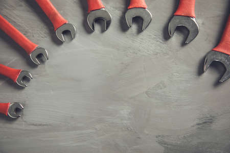 wrenches of different sizes on abstract backgroundの写真素材