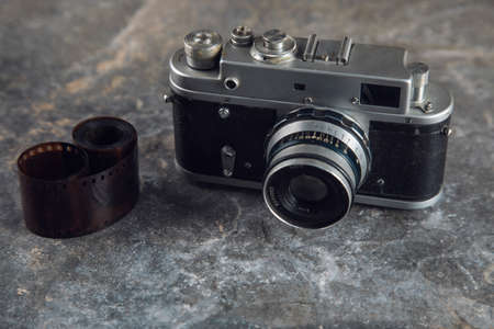photo tape and vintage camera on tableの写真素材